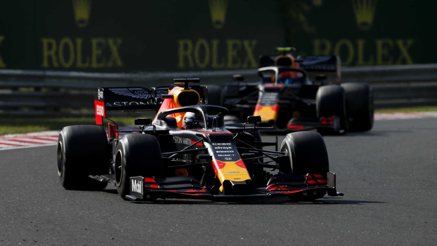 HUNGARORING, HUNGARY - AUGUST 04: Max Verstappen, Red Bull Racing RB15, leads Pierre Gasly, Red