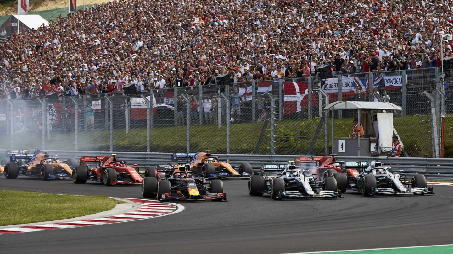 HUNGARORING, HUNGARY - AUGUST 04: Max Verstappen, Red Bull Racing RB15, leads Lewis Hamilton,