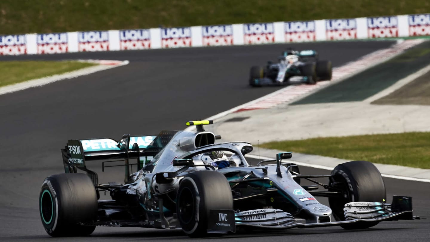 HUNGARORING, HUNGARY - AUGUST 04: Valtteri Bottas, Mercedes AMG W10, leads Lewis Hamilton, Mercedes