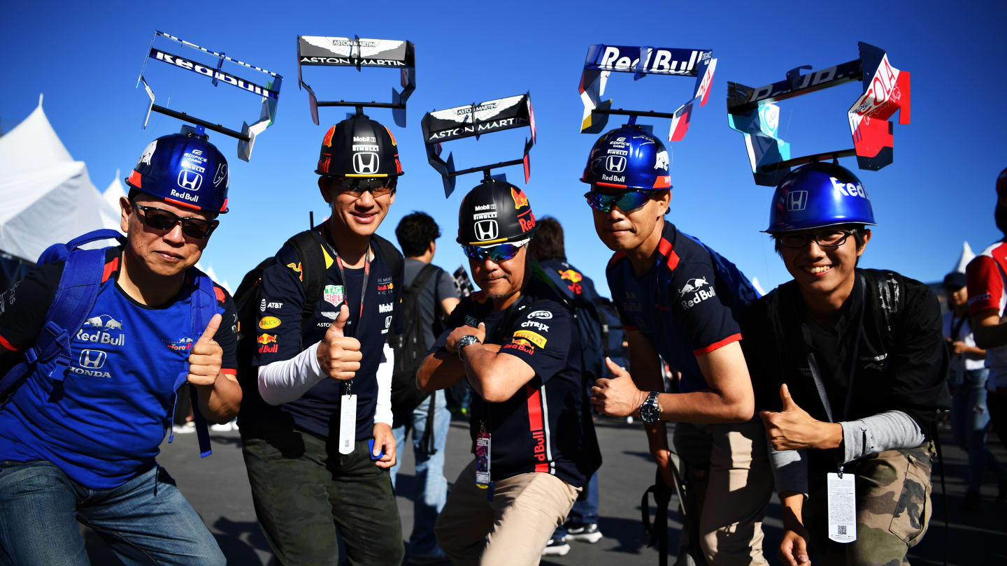 SUZUKA, JAPAN - OCTOBER 13: Red Bull Racing and Scuderia Toro Rosso fans show their support before