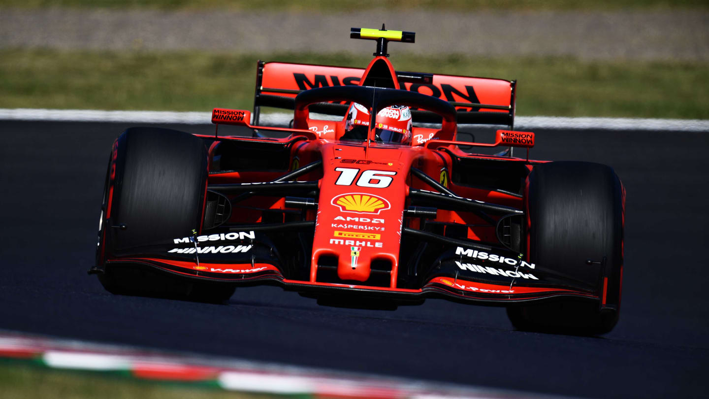 SUZUKA, JAPAN - OCTOBER 13: Charles Leclerc of Monaco driving the (16) Scuderia Ferrari SF90 on the way to the grid before the F1 Grand Prix of Japan at Suzuka Circuit on October 13, 2019 in Suzuka, Japan. (Photo by Clive Mason/Getty Images)