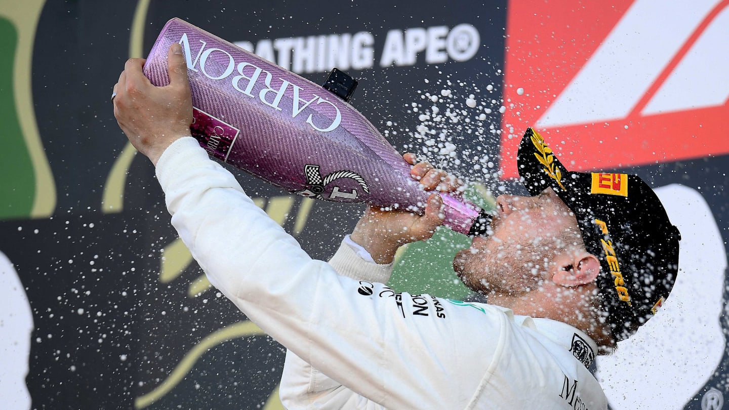 SUZUKA, JAPAN - OCTOBER 13: Race winner Valtteri Bottas of Finland and Mercedes GP celebrates on the podium during the F1 Grand Prix of Japan at Suzuka Circuit on October 13, 2019 in Suzuka, Japan. (Photo by Clive Mason/Getty Images)