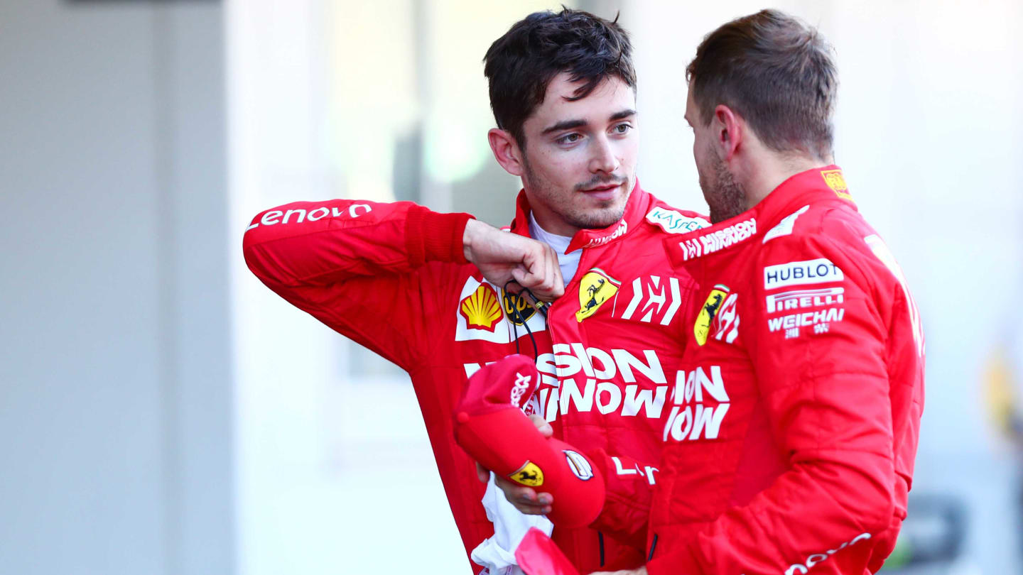 SUZUKA, JAPAN - OCTOBER 13: Charles Leclerc of Monaco and Ferrari talks with second placed Sebastian Vettel of Germany and Ferrari in parc ferme during the F1 Grand Prix of Japan at Suzuka Circuit on October 13, 2019 in Suzuka, Japan. (Photo by Dan Istitene/Getty Images)