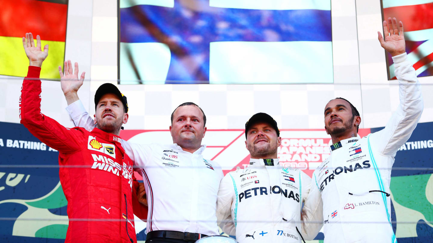 SUZUKA, JAPAN - OCTOBER 13: Top three finishers Valtteri Bottas of Finland and Mercedes GP,