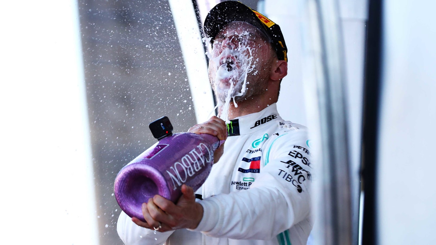 SUZUKA, JAPAN - OCTOBER 13: Race winner Valtteri Bottas of Finland and Mercedes GP celebrates on the podium during the F1 Grand Prix of Japan at Suzuka Circuit on October 13, 2019 in Suzuka, Japan. (Photo by Mark Thompson/Getty Images)