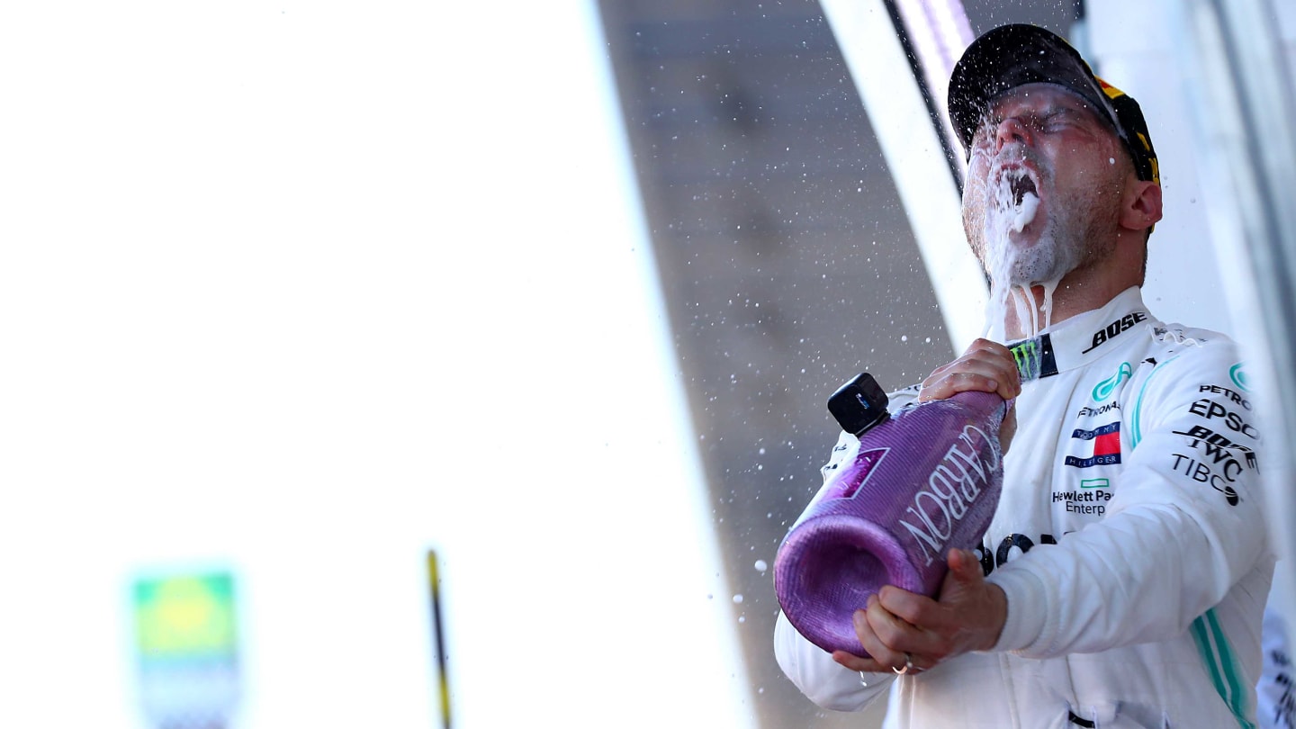 SUZUKA, JAPAN - OCTOBER 13: Race winner Valtteri Bottas of Finland and Mercedes GP celebrates on