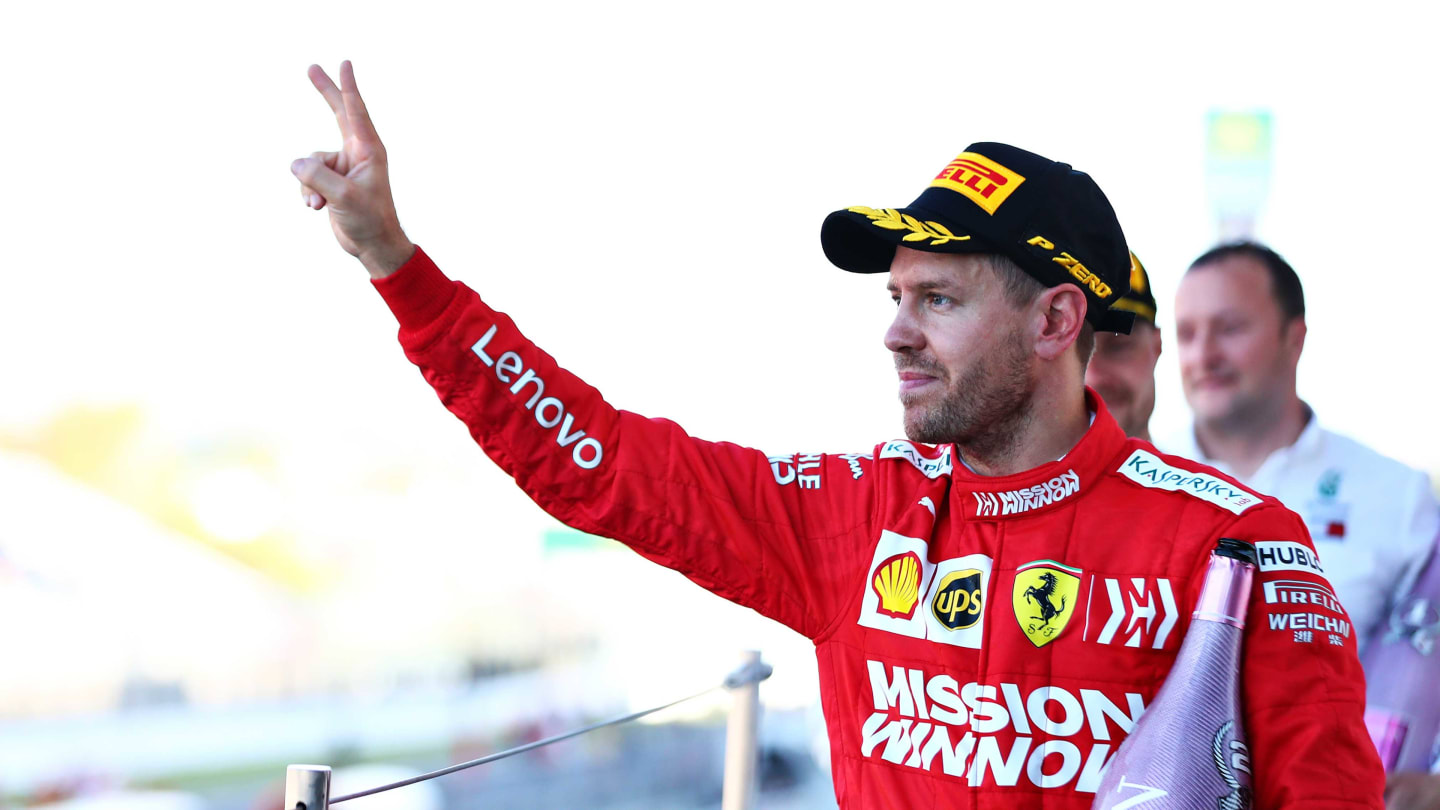 SUZUKA, JAPAN - OCTOBER 13: Second placed Sebastian Vettel of Germany and Ferrari celebrates on the podium during the F1 Grand Prix of Japan at Suzuka Circuit on October 13, 2019 in Suzuka, Japan. (Photo by Mark Thompson/Getty Images)