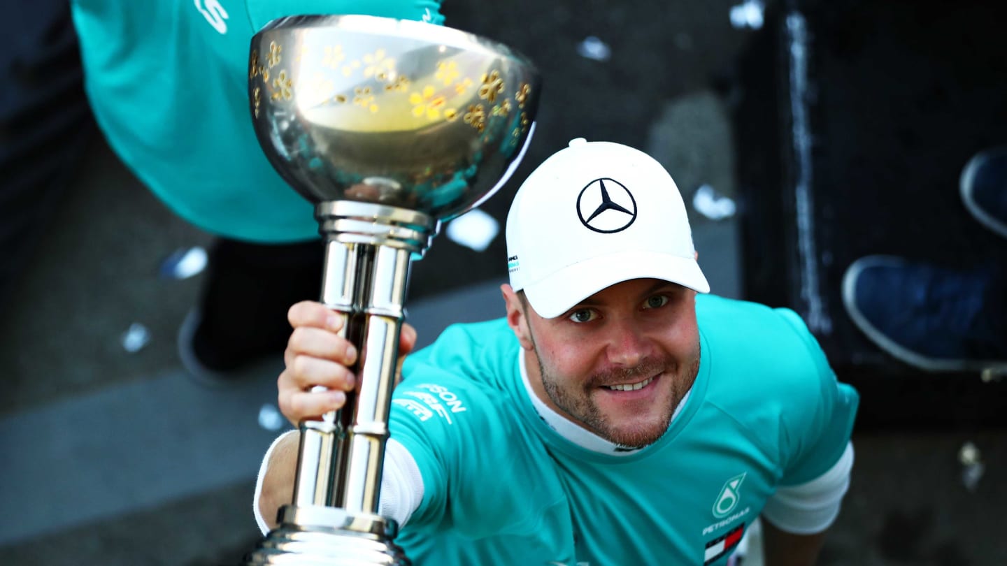 SUZUKA, JAPAN - OCTOBER 13: Race winner Valtteri Bottas of Finland and Mercedes GP celebrates after