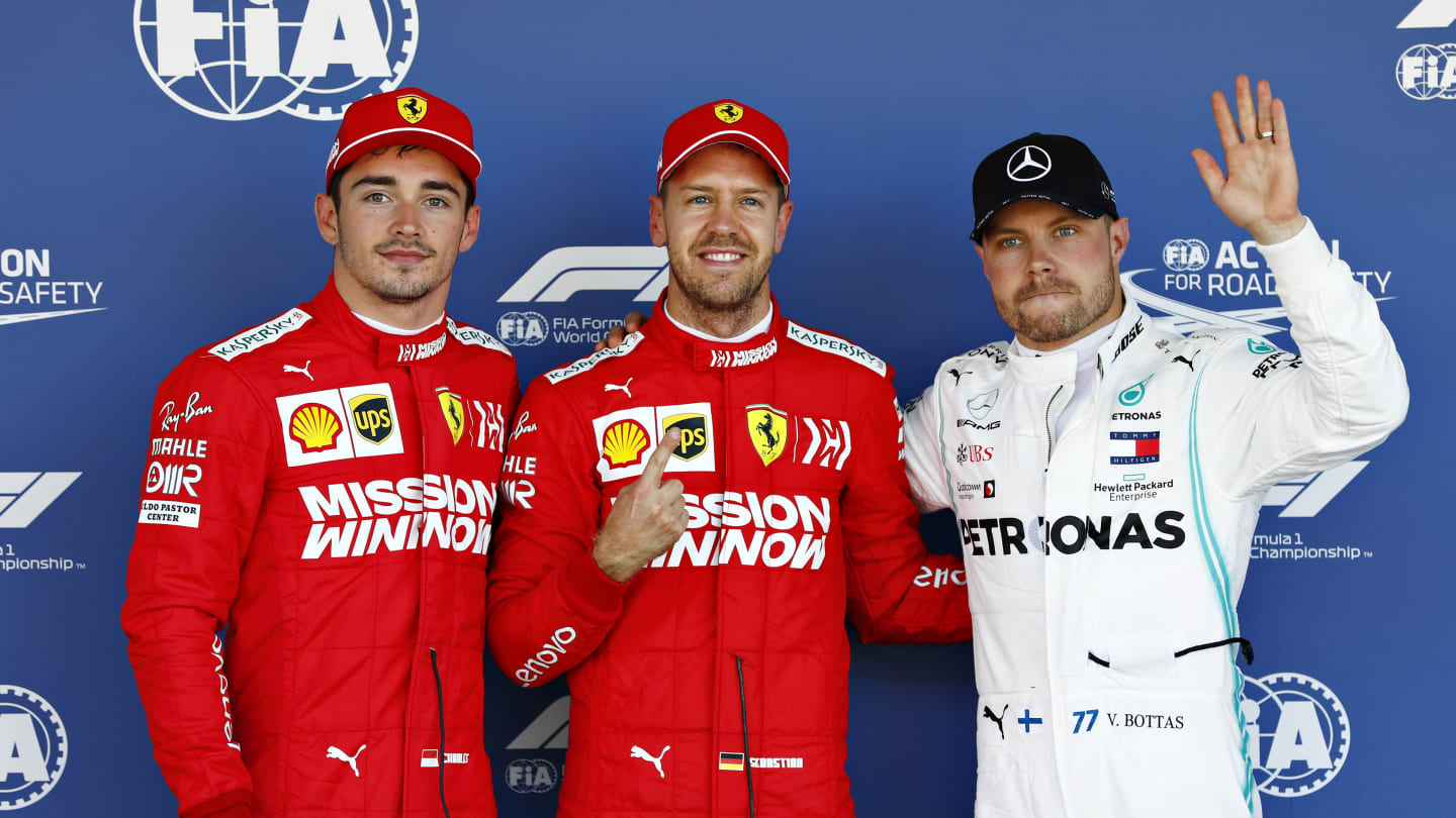 SUZUKA, JAPAN - OCTOBER 13: Top three qualifiers Sebastian Vettel of Germany and Ferrari, Charles