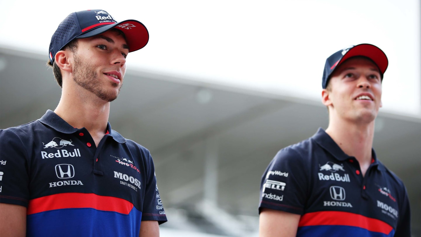 SUZUKA, JAPAN - OCTOBER 10: Pierre Gasly of France and Scuderia Toro Rosso and Daniil Kvyat of