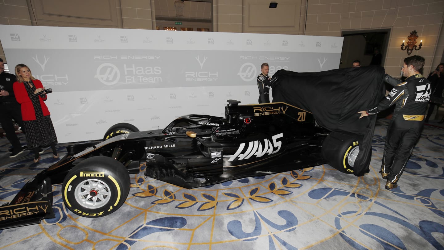 THE ROYAL AUTOMOBILE CLUB, UNITED KINGDOM - FEBRUARY 07: Romain Grosjean, Haas F1 Team and Kevin Magnussen, Haas F1 Team unveil the new livery on the Haas F1 Team VF-18 during the Haas Livery Launch at The Royal Automobile Club on February 07, 2019 in The Royal Automobile Club, United Kingdom. (Photo by Joe Portlock / LAT Images)