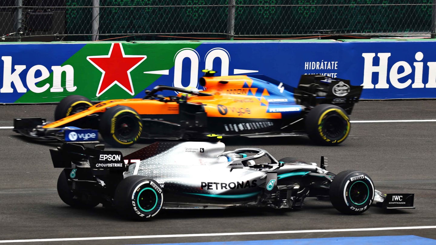 MEXICO CITY, MEXICO - OCTOBER 25: Valtteri Bottas driving the (77) Mercedes AMG Petronas F1 Team Mercedes W10 faces the wrong way as he is passed by Lando Norris of Great Britain driving the (4) McLaren F1 Team MCL34 Renault on track during practice for the F1 Grand Prix of Mexico at Autodromo Hermanos Rodriguez on October 25, 2019 in Mexico City, Mexico. (Photo by Mark Thompson/Getty Images)