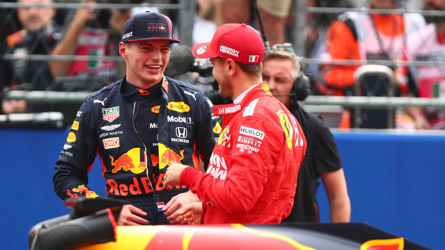 MEXICO CITY, MEXICO - OCTOBER 26: Pole position qualifier Max Verstappen of Netherlands and Red Bull Racing talks with third place qualifier Sebastian Vettel of Germany and Ferrari in parc ferme during qualifying for the F1 Grand Prix of Mexico at Autodromo Hermanos Rodriguez on October 26, 2019 in Mexico City, Mexico. (Photo by Dan Istitene/Getty Images)