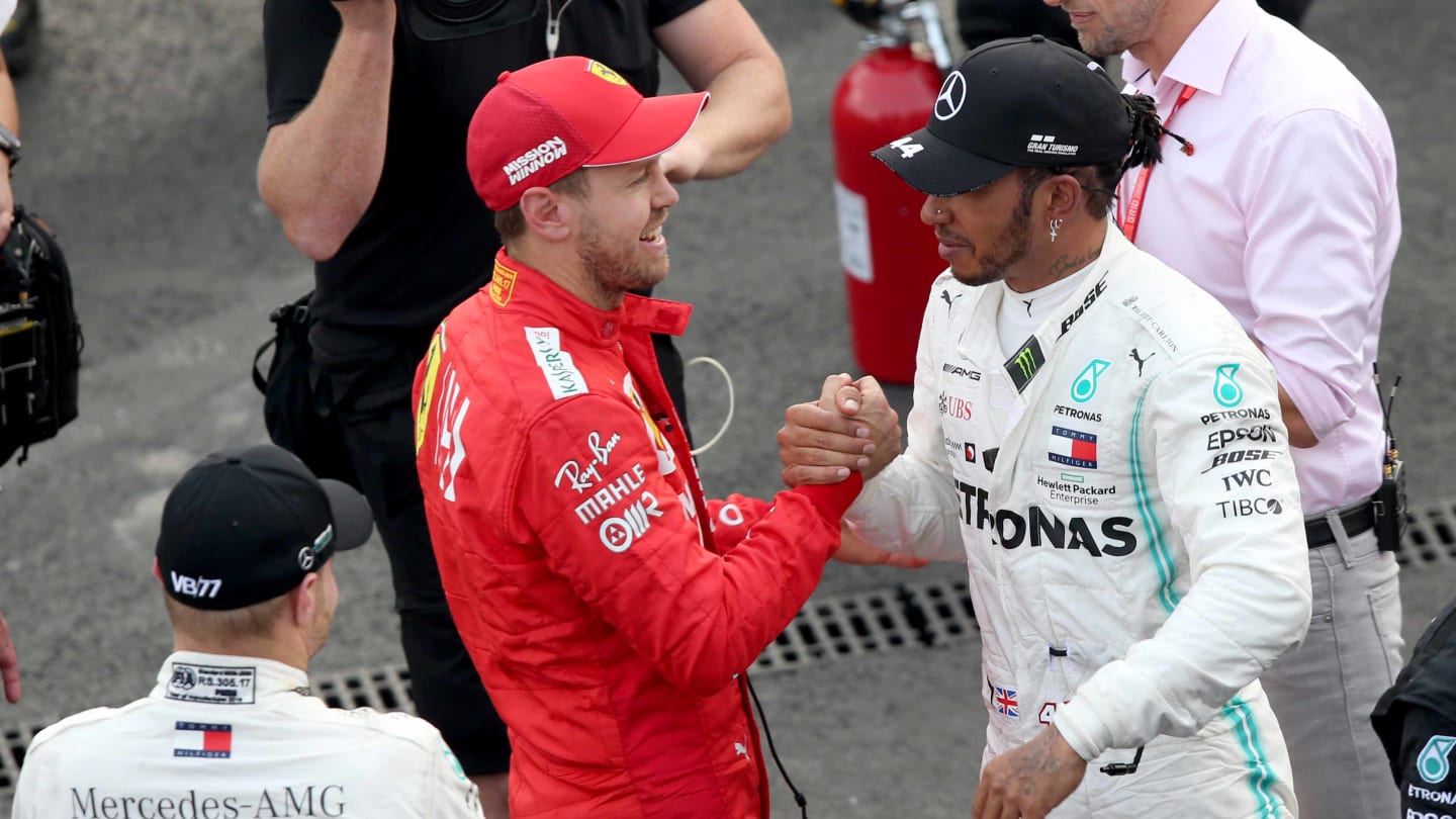 MEXICO CITY, MEXICO - OCTOBER 27: Race winner Lewis Hamilton of Great Britain and Mercedes GP and second placed Sebastian Vettel of Germany and Ferrari celebrate in parc ferme during the F1 Grand Prix of Mexico at Autodromo Hermanos Rodriguez on October 27, 2019 in Mexico City, Mexico. (Photo by Charles Coates/Getty Images)