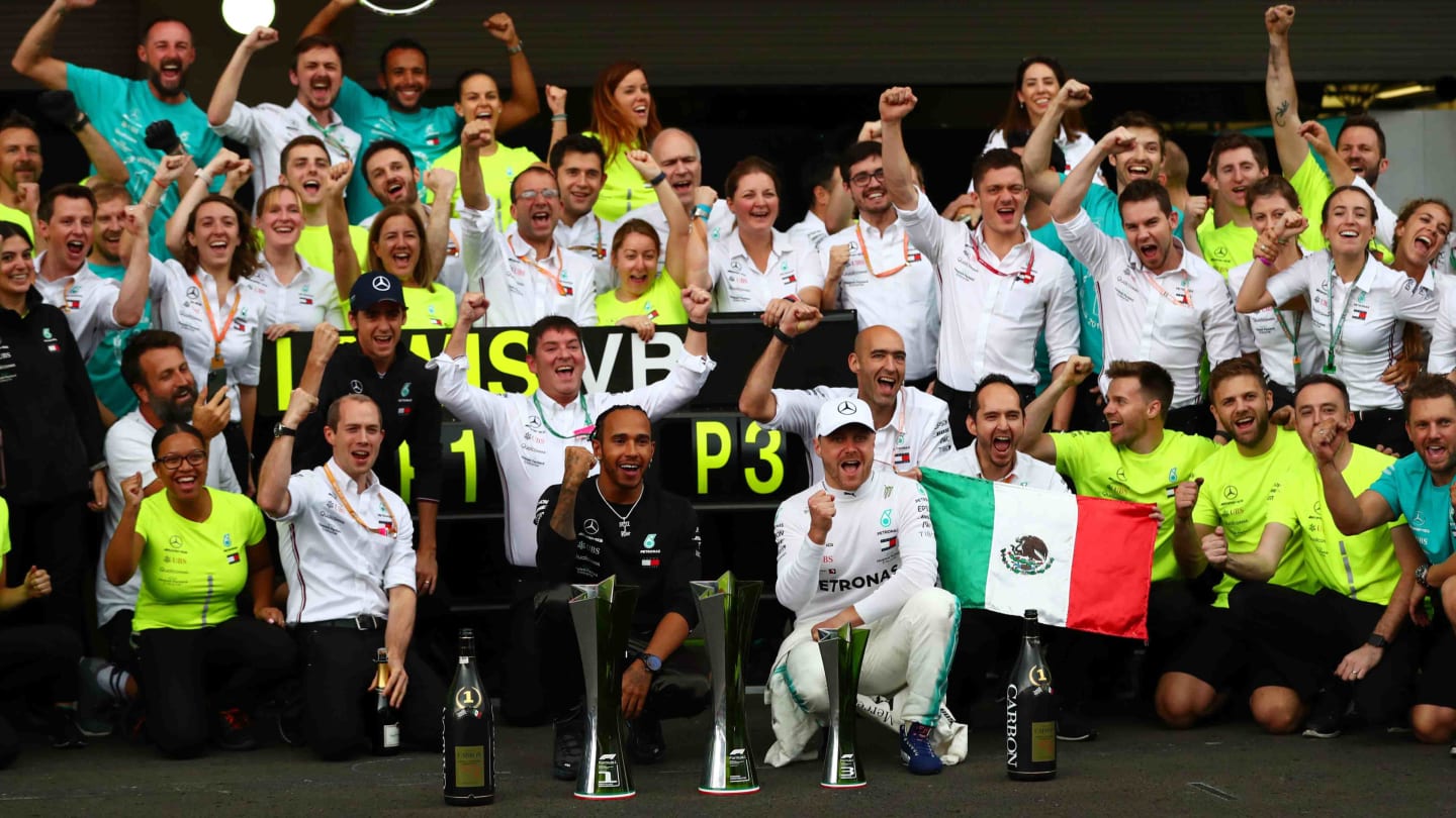 MEXICO CITY, MEXICO - OCTOBER 27: Race winner Lewis Hamilton of Great Britain and Mercedes GP and third placed Valtteri Bottas of Finland and Mercedes GP celebrate with their team after the F1 Grand Prix of Mexico at Autodromo Hermanos Rodriguez on October 27, 2019 in Mexico City, Mexico. (Photo by Dan Istitene/Getty Images)