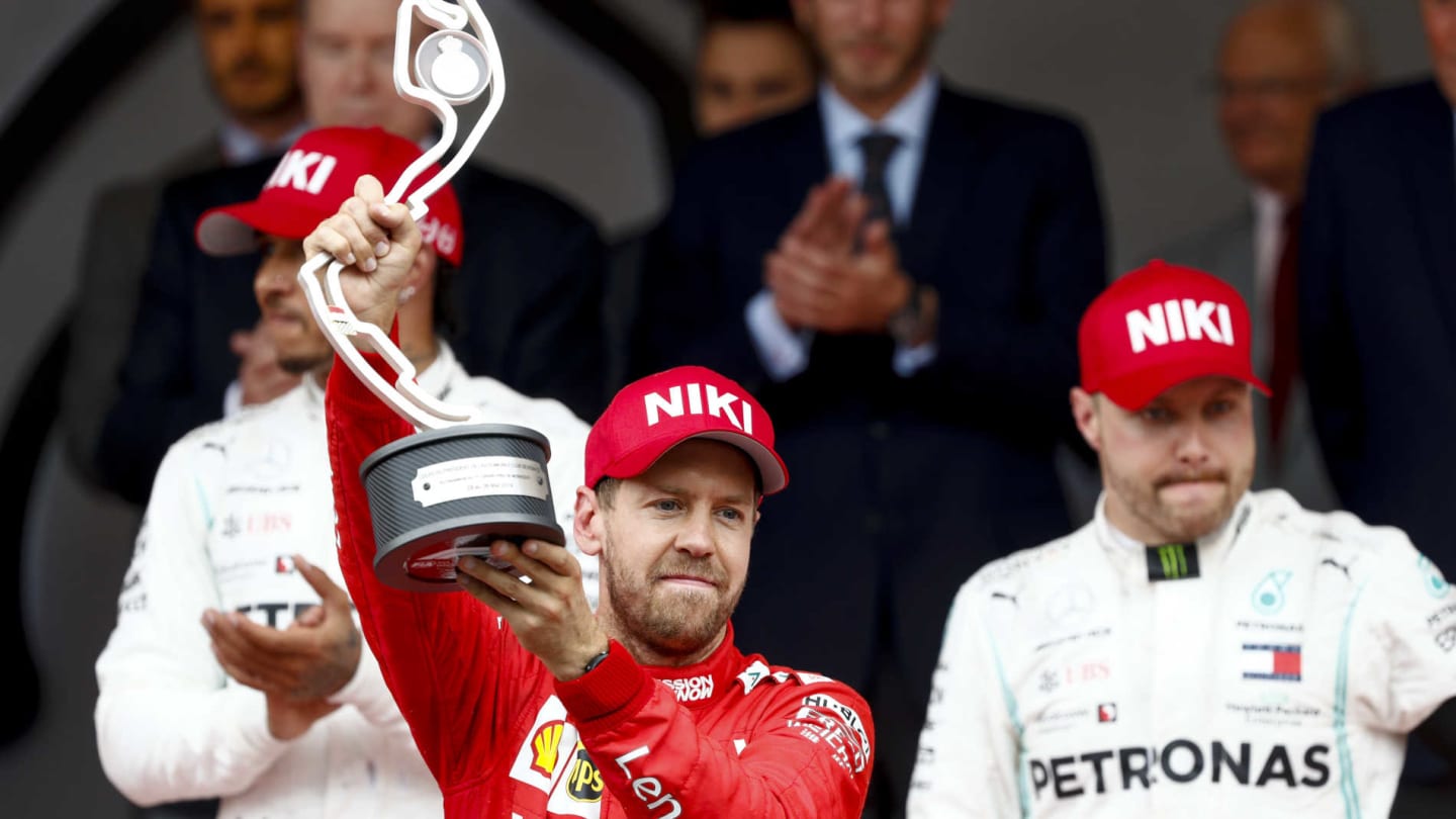 MONTE CARLO, MONACO - MAY 26: Sebastian Vettel, Ferrari celebrates on the podium with the trophy during the Monaco GP at Monte Carlo on May 26, 2019 in Monte Carlo, Monaco. (Photo by Glenn Dunbar / LAT Images)