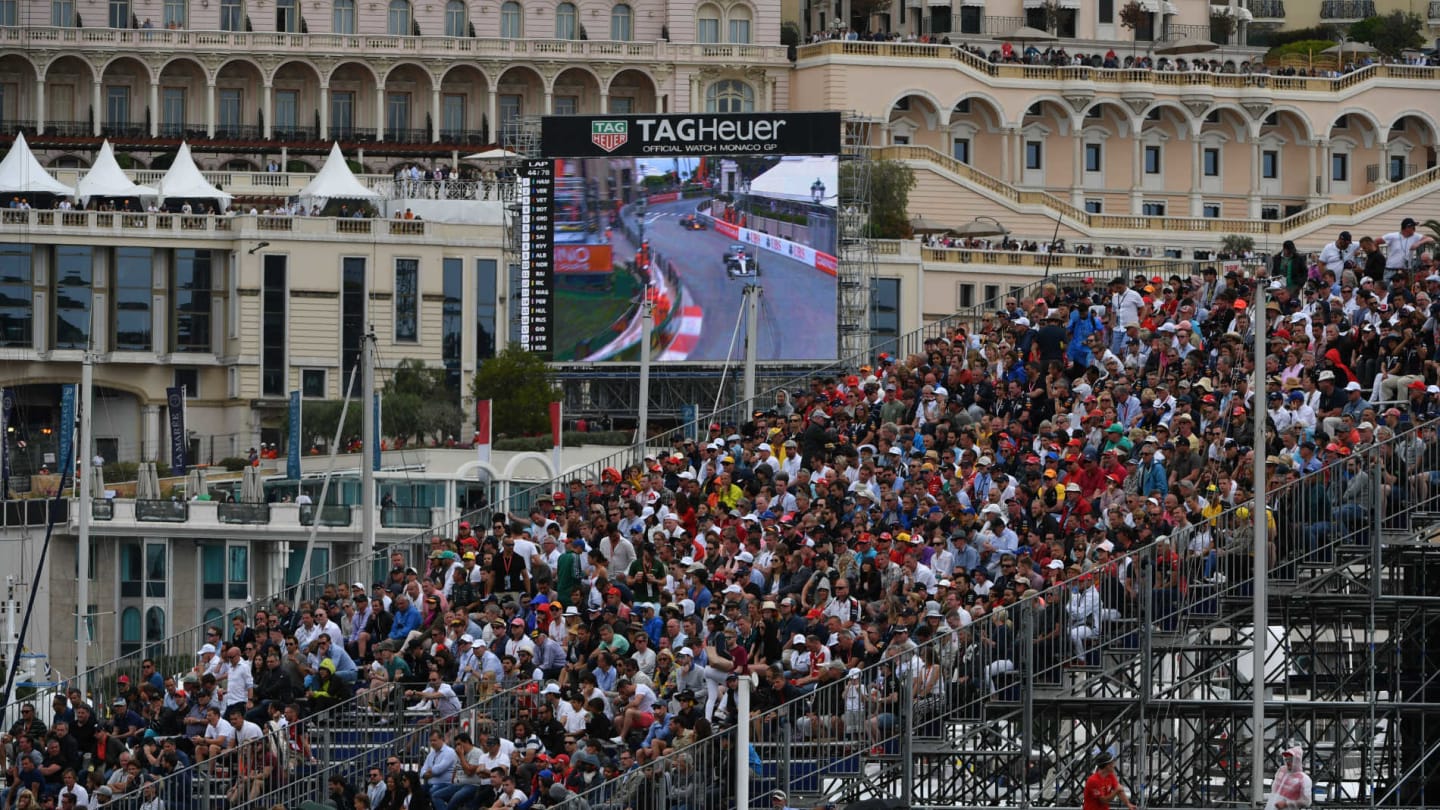 MONTE CARLO, MONACO - MAY 26: Fans in a grandstand and a trackside screen during the Monaco GP at