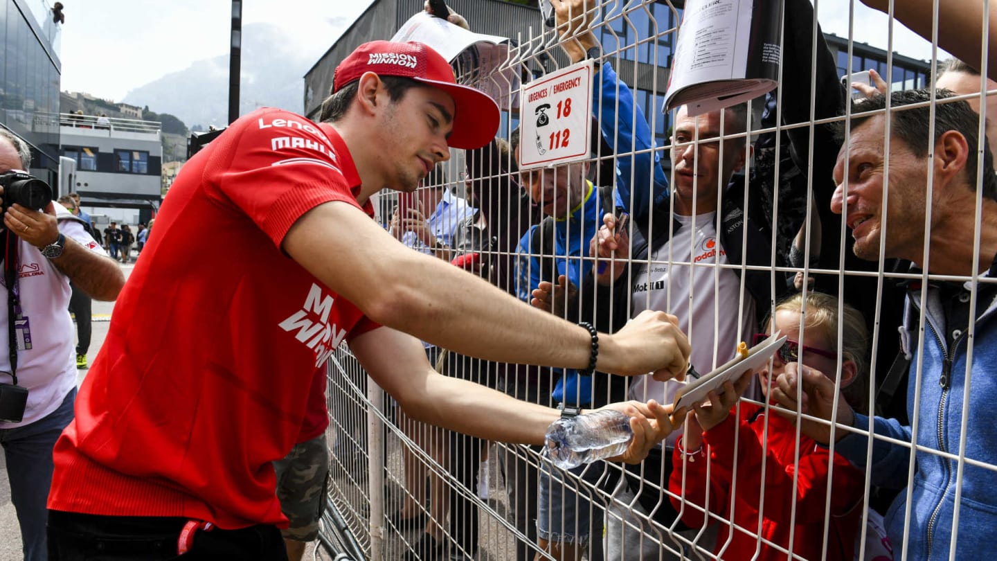 MONTE CARLO, MONACO - MAY 22: Charles Leclerc, Ferrari signs an autograph for a fan during the
