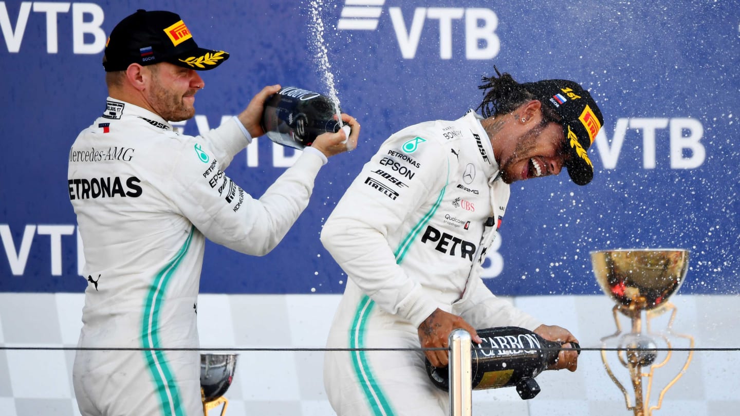 SOCHI, RUSSIA - SEPTEMBER 29: Race winner Lewis Hamilton of Great Britain and Mercedes GP and second placed Valtteri Bottas of Finland and Mercedes GP celebrate on the podium during the F1 Grand Prix of Russia at Sochi Autodrom on September 29, 2019 in Sochi, Russia. (Photo by Clive Mason/Getty Images)