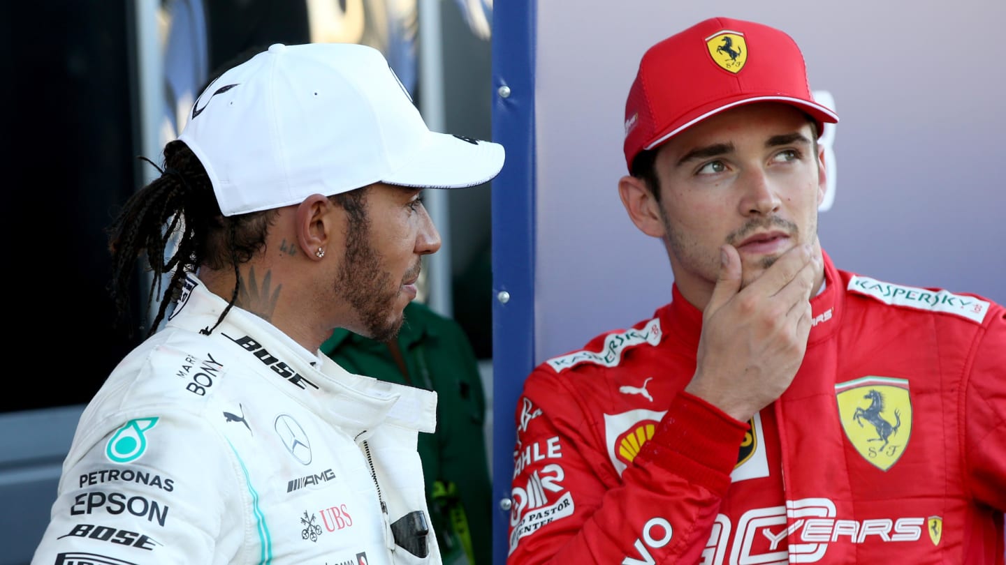 SOCHI, RUSSIA - SEPTEMBER 29: Third placed Charles Leclerc of Monaco and Ferrari and race winner Lewis Hamilton of Great Britain and Mercedes GP talk in parc ferme during the F1 Grand Prix of Russia at Sochi Autodrom on September 29, 2019 in Sochi, Russia. (Photo by Charles Coates/Getty Images)