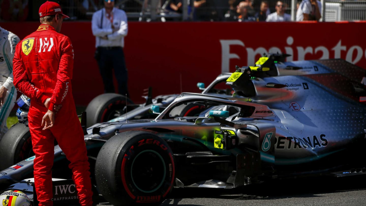 CIRCUIT DE BARCELONA-CATALUNYA, SPAIN - MAY 11: Sebastian Vettel, Ferrari looks at the car of Pole