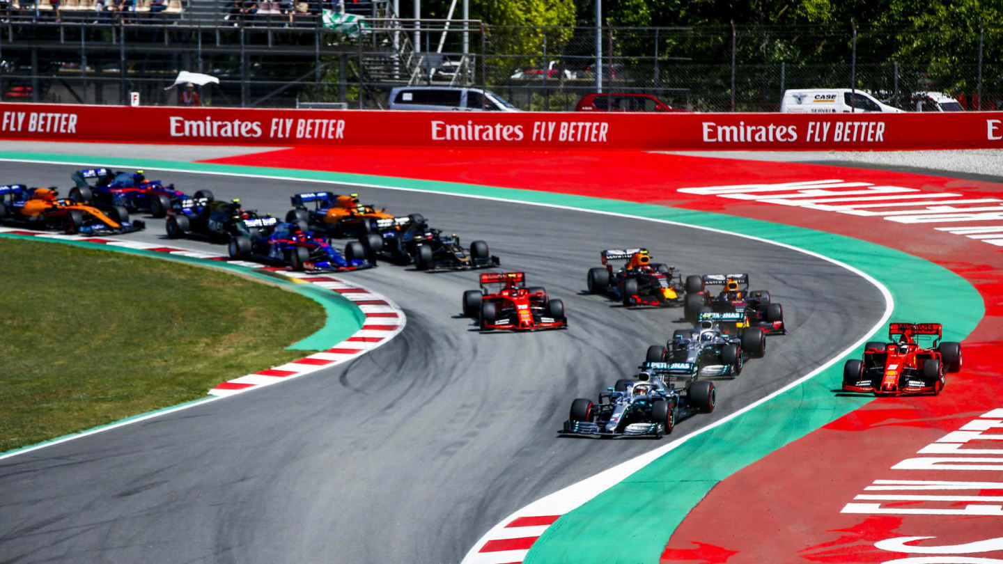 CIRCUIT DE BARCELONA-CATALUNYA, SPAIN - MAY 12: Lewis Hamilton, Mercedes AMG F1 W10, leads Valtteri Bottas, Mercedes AMG W10 into the first corner as Sebastian Vettel, Ferrari SF90 runs wide ahead of Max Verstappen, Red Bull Racing RB15, Charles Leclerc, Ferrari SF90, Pierre Gasly, Red Bull Racing RB15, and the rest of the field during the Spanish GP at Circuit de Barcelona-Catalunya on May 12, 2019 in Circuit de Barcelona-Catalunya, Spain. (Photo by Andy Hone / LAT Images)