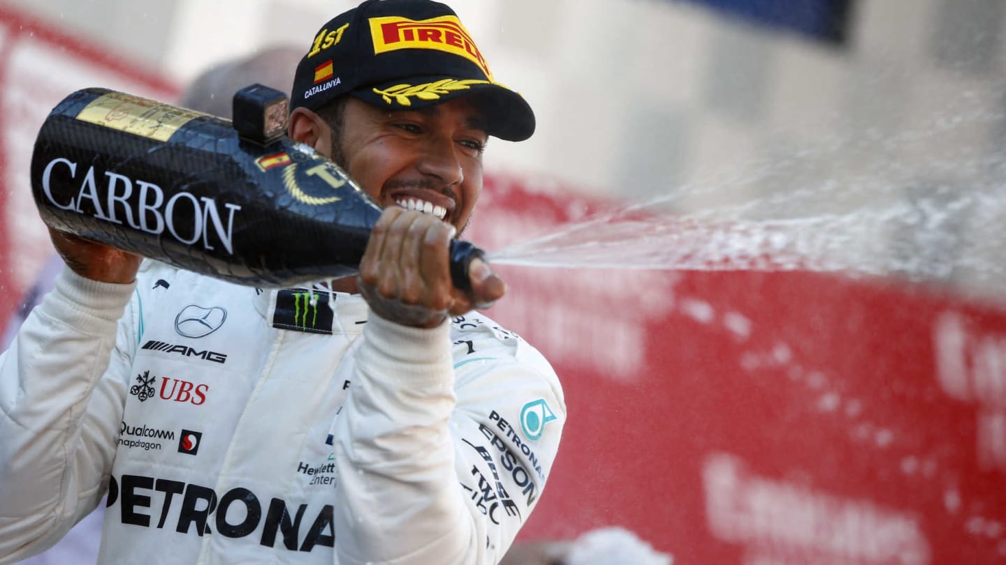 CIRCUIT DE BARCELONA-CATALUNYA, SPAIN - MAY 12: Lewis Hamilton, Mercedes AMG F1, 1st position, sprays Champagne on the podium during the Spanish GP at Circuit de Barcelona-Catalunya on May 12, 2019 in Circuit de Barcelona-Catalunya, Spain. (Photo by Andy Hone / LAT Images)