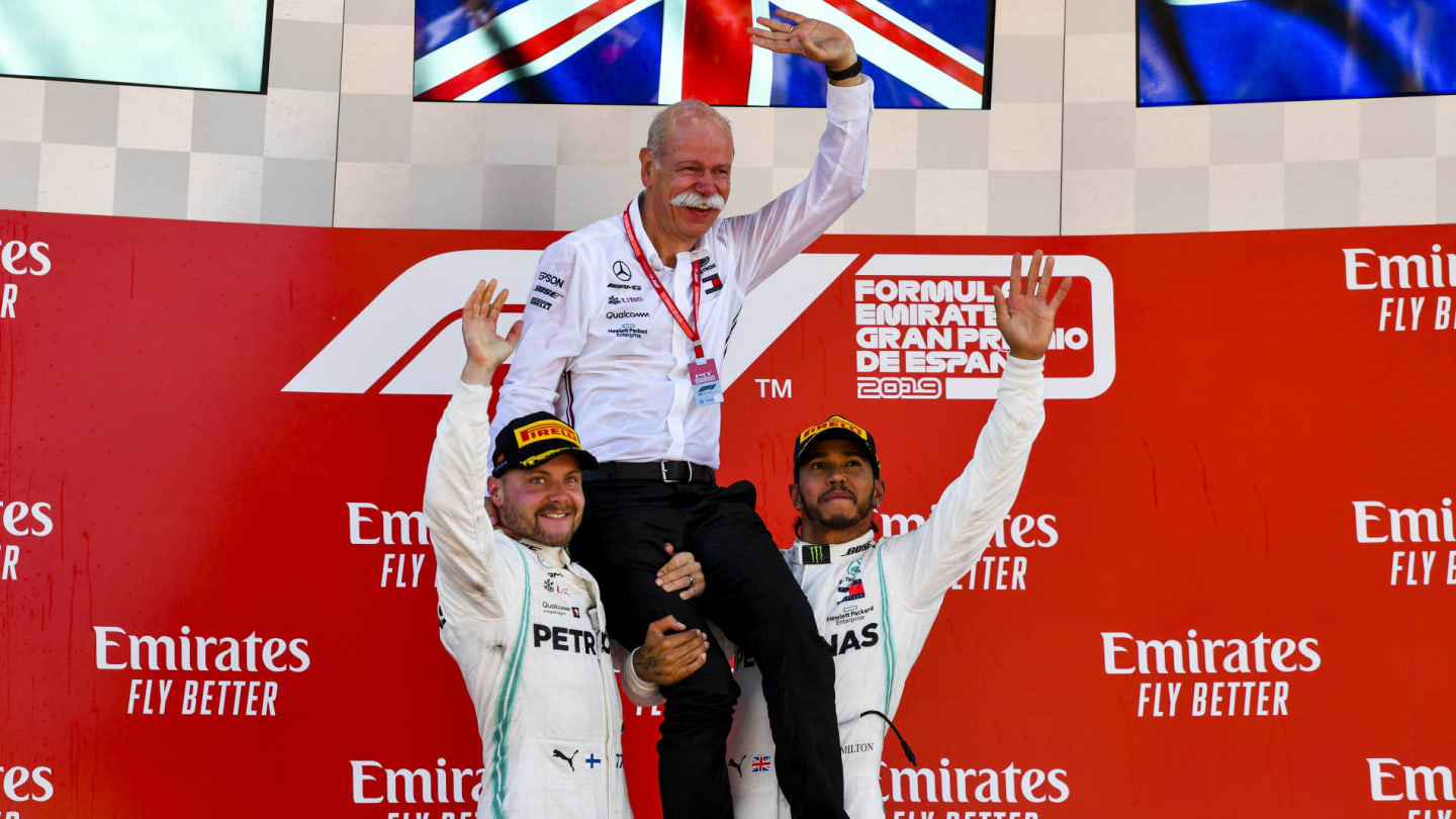 CIRCUIT DE BARCELONA-CATALUNYA, SPAIN - MAY 12: Valtteri Bottas, Mercedes AMG F1, 2nd position, and Lewis Hamilton, Mercedes AMG F1, 1st position, lift Dr Dieter Zetsche, CEO, Mercedes Benz, on their shoulders on the podium during the Spanish GP at Circuit de Barcelona-Catalunya on May 12, 2019 in Circuit de Barcelona-Catalunya, Spain. (Photo by Mark Sutton / Sutton Images)