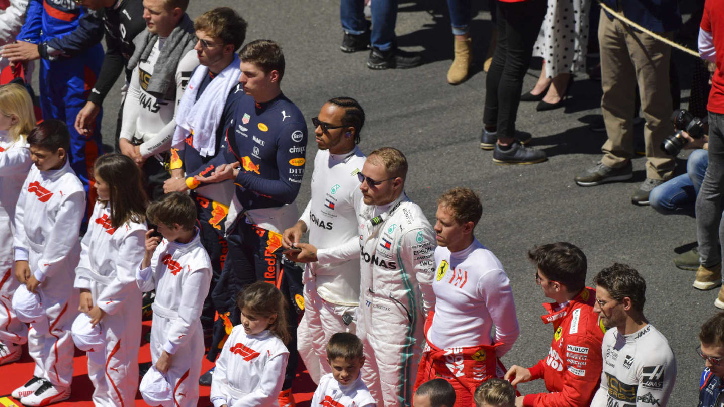 CIRCUIT DE BARCELONA-CATALUNYA, SPAIN - MAY 12: The drivers line up behind the grid kids for the