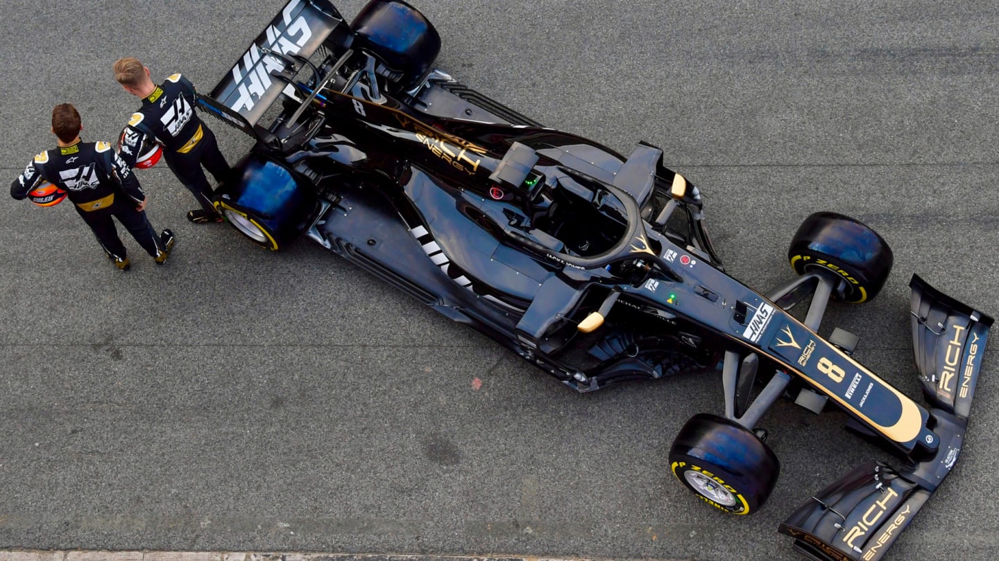CIRCUIT DE BARCELONA-CATALUNYA, SPAIN - FEBRUARY 18: The Haas F1 Team VF-19 is unveiled in the Barcelona pit lane by Kevin Magnussen, Haas F1 Team, and Romain Grosjean, Haas F1 Team during the Barcelona February testing at Circuit de Barcelona-Catalunya on February 18, 2019 in Circuit de Barcelona-Catalunya, Spain. (Photo by Jerry Andre / Sutton Images)