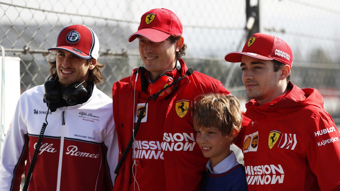 CIRCUIT DE BARCELONA-CATALUNYA, SPAIN - MARCH 01: (L to R): Antonio Giovinazzi, Alfa Romeo Racing, John Elkann, FIAT Chairman with his son and Charles Leclerc, Ferrari during the Barcelona February testing II at Circuit de Barcelona-Catalunya on March 01, 2019 in Circuit de Barcelona-Catalunya, Spain. (Photo by Zak Mauger / LAT Images)