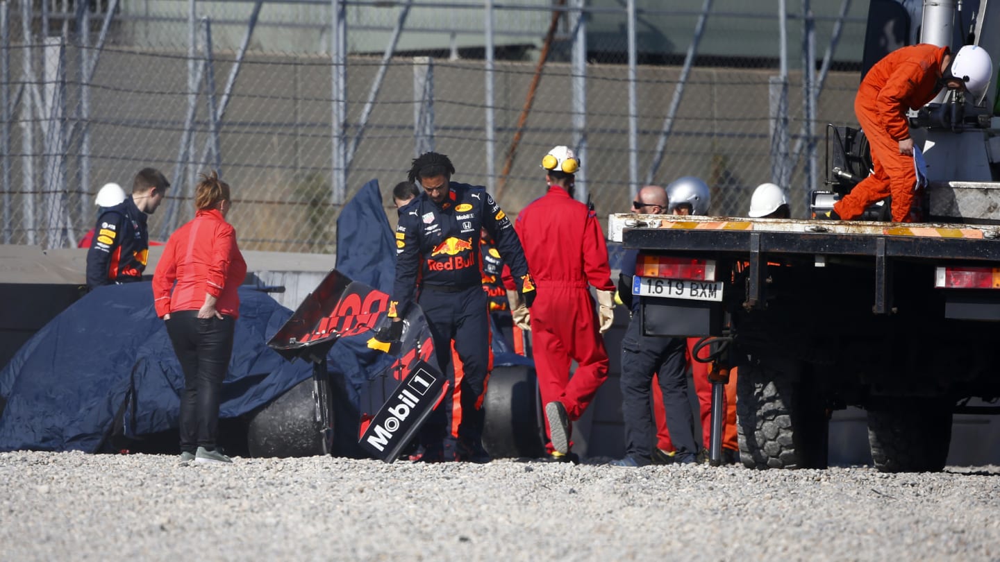 CIRCUIT DE BARCELONA-CATALUNYA, SPAIN - FEBRUARY 28: The crashed car of Pierre Gasly, Red Bull Racing RB15 is recovered after crashing during the Barcelona February testing II at Circuit de Barcelona-Catalunya on February 28, 2019 in Circuit de Barcelona-Catalunya, Spain. (Photo by Andy Hone / LAT Images)