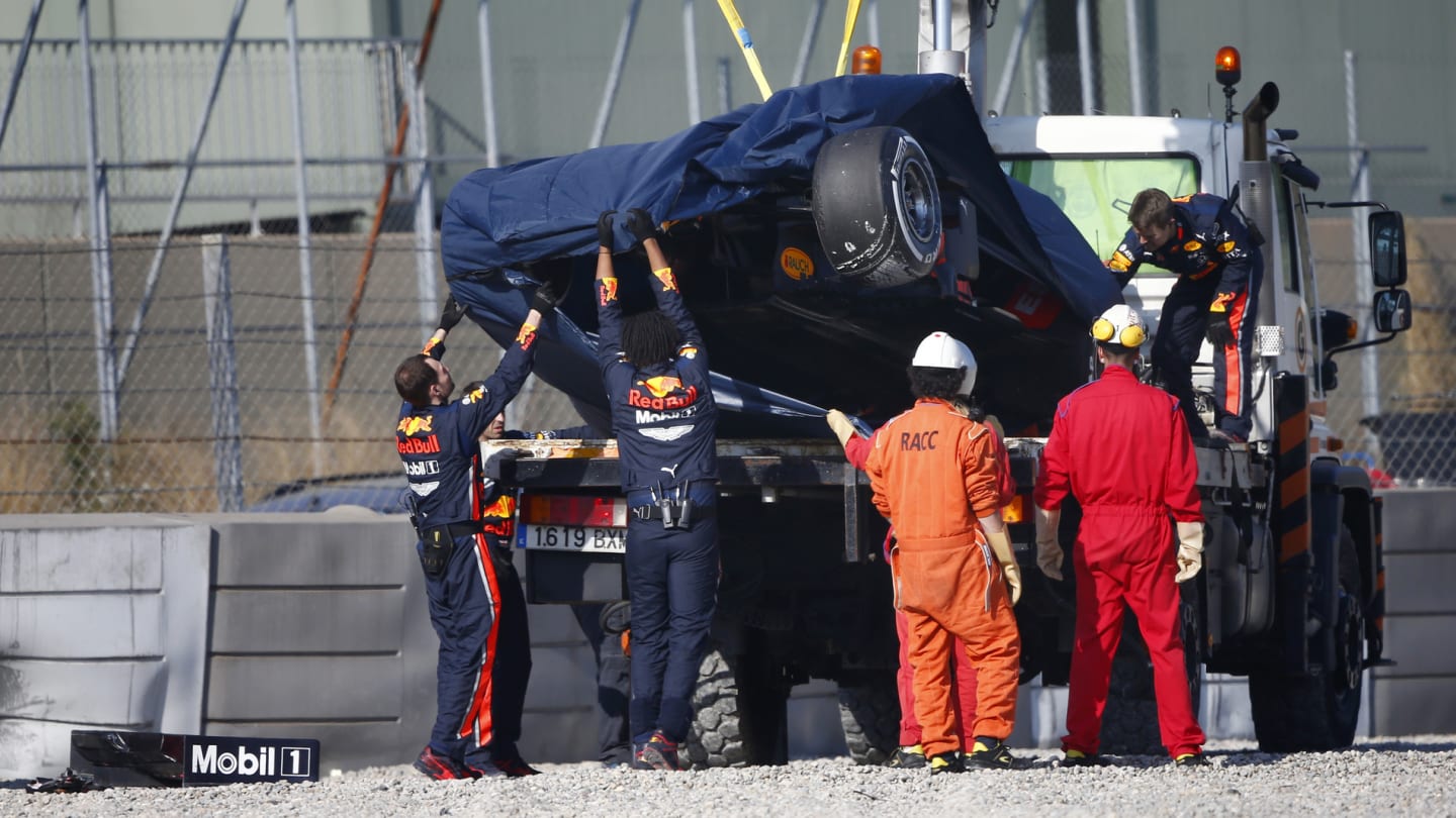 CIRCUIT DE BARCELONA-CATALUNYA, SPAIN - FEBRUARY 28: The crashed car of Pierre Gasly, Red Bull Racing RB15 is recovered during the Barcelona February testing II at Circuit de Barcelona-Catalunya on February 28, 2019 in Circuit de Barcelona-Catalunya, Spain. (Photo by Andy Hone / LAT Images)