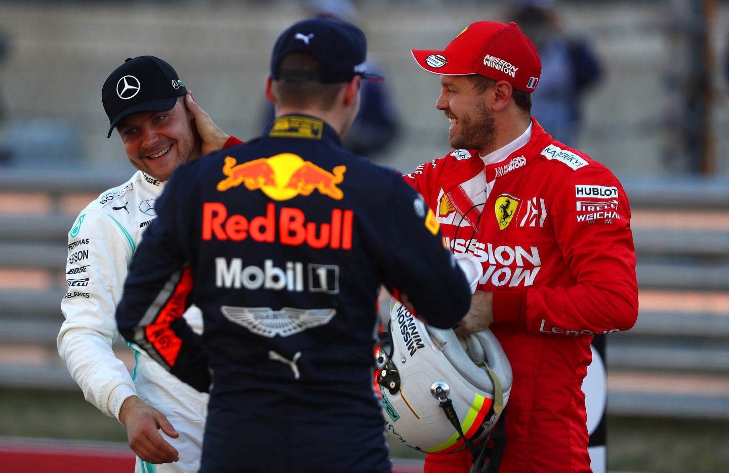 AUSTIN, TEXAS - NOVEMBER 02: Top three qualifiers Valtteri Bottas of Finland and Mercedes GP, Sebastian Vettel of Germany and Ferrari and Max Verstappen of Netherlands and Red Bull Racing celebrate in parc ferme during qualifying for the F1 Grand Prix of USA at Circuit of The Americas on November 02, 2019 in Austin, Texas. (Photo by Mark Thompson/Getty Images)