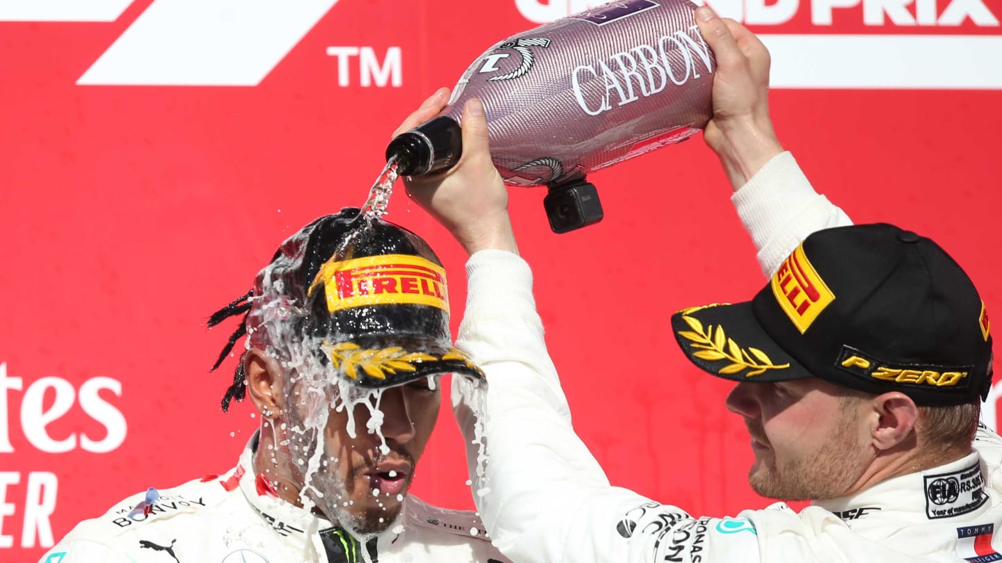 AUSTIN, TEXAS - NOVEMBER 03: Race winner Valtteri Bottas of Finland and Mercedes GP, 2019 Formula One World Drivers Champion Lewis Hamilton of Great Britain and Mercedes GP and James Allison, Technical Director at Mercedes GP celebrate on the podium during the F1 Grand Prix of USA at Circuit of The Americas on November 03, 2019 in Austin, Texas. (Photo by Charles Coates/Getty Images)