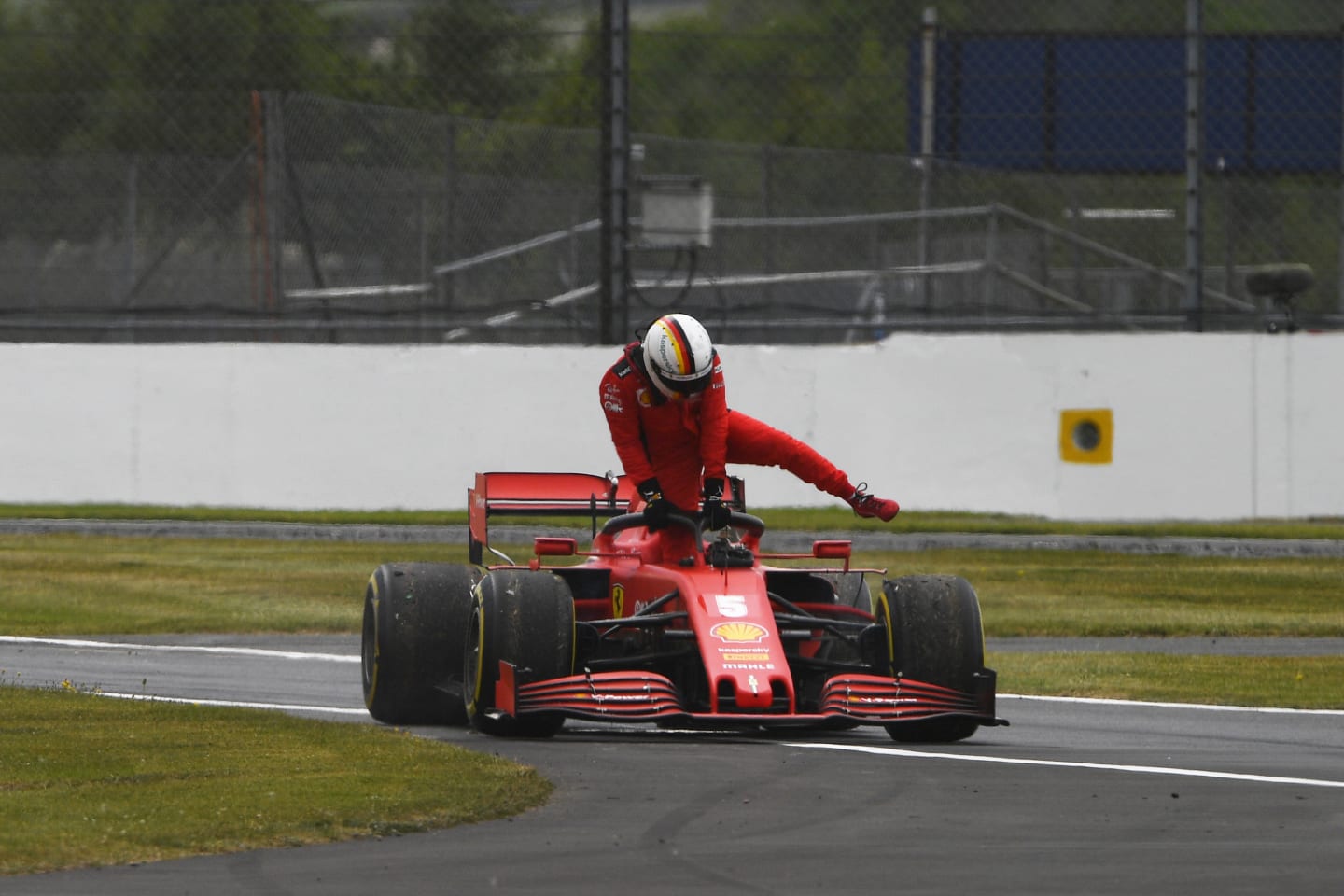 NORTHAMPTON, ENGLAND - AUGUST 07: Sebastian Vettel of Germany driving the (5) Scuderia Ferrari