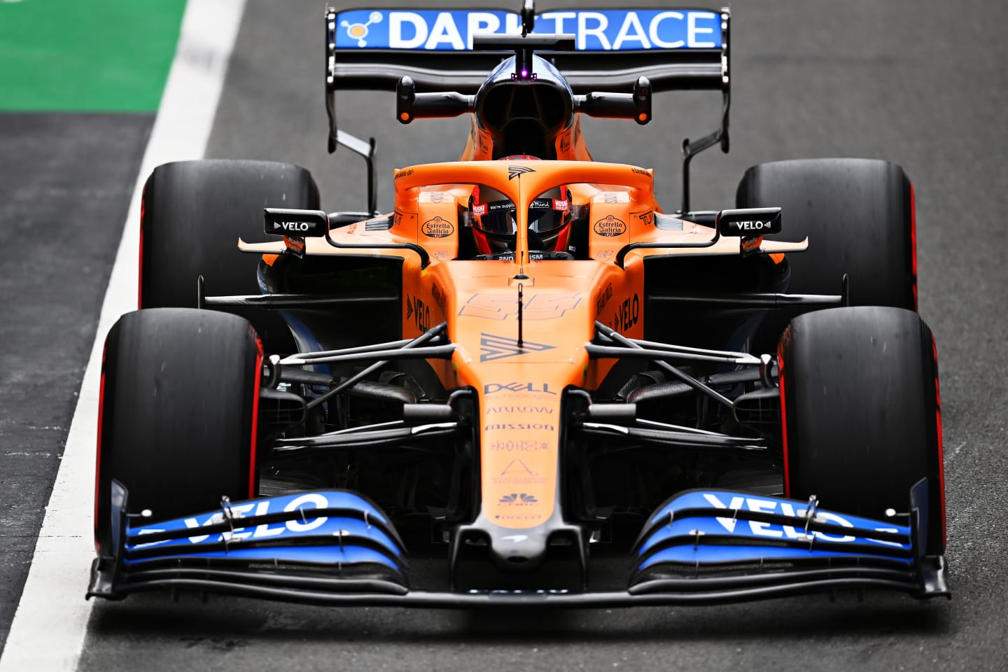 NORTHAMPTON, ENGLAND - AUGUST 07: Carlos Sainz of Spain driving the (55) McLaren F1 Team MCL35