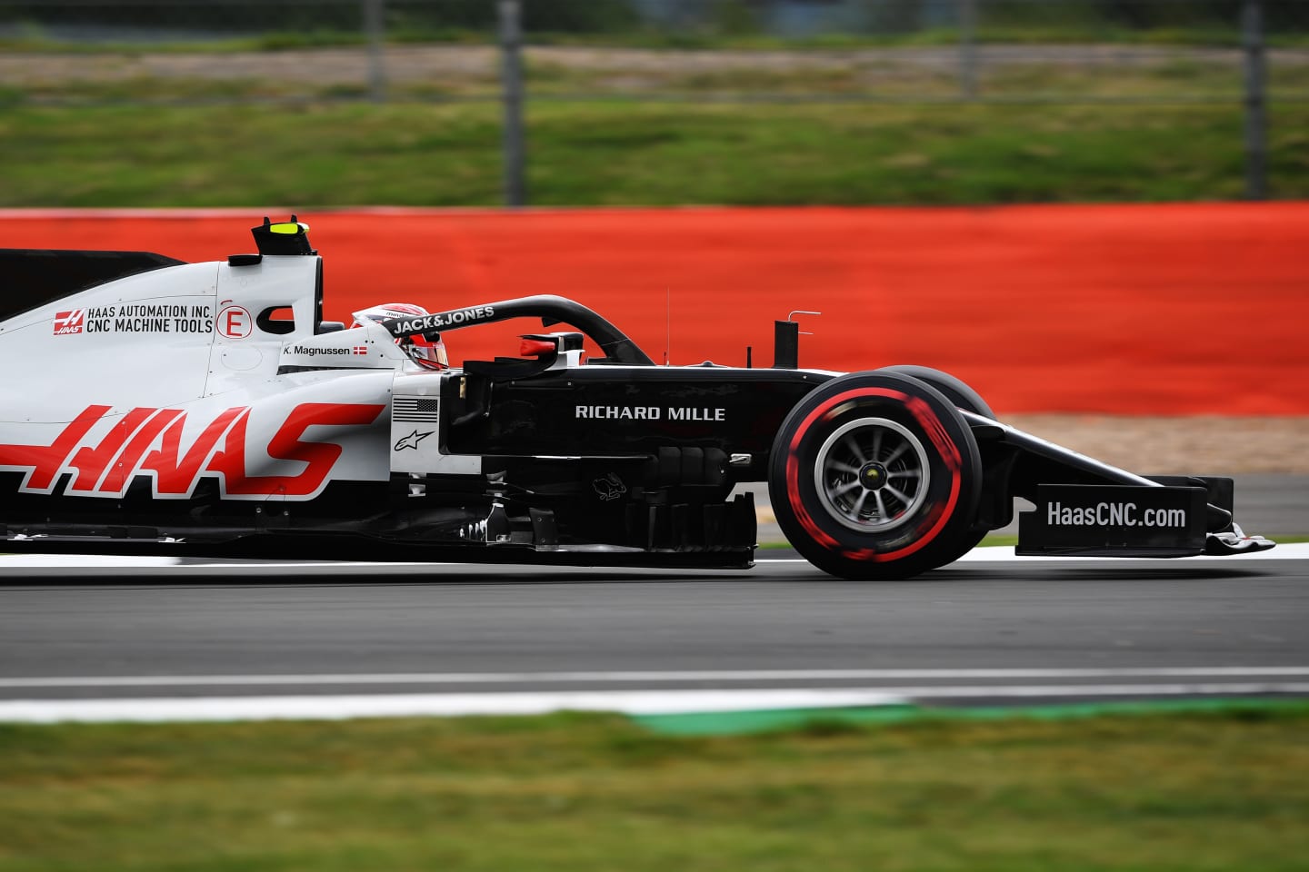 NORTHAMPTON, ENGLAND - AUGUST 07: Kevin Magnussen of Denmark driving the (20) Haas F1 Team VF-20