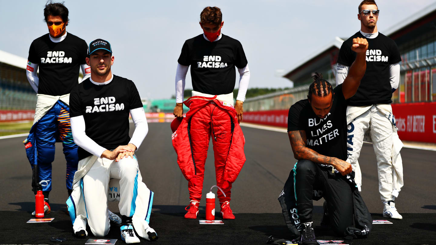 NORTHAMPTON, ENGLAND - AUGUST 09: Lewis Hamilton of Great Britain and Mercedes GP and Nicholas