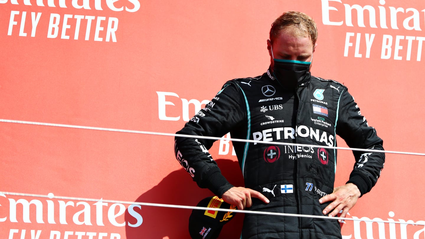 NORTHAMPTON, ENGLAND - AUGUST 09: Third placed Valtteri Bottas of Finland and Mercedes GP reacts on