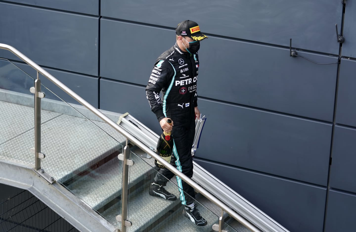 NORTHAMPTON, ENGLAND - AUGUST 09: Third placed Valtteri Bottas of Finland and Mercedes GP walks with his trophy during the F1 70th Anniversary Grand Prix at Silverstone on August 09, 2020 in Northampton, England. (Photo by Will Oliver/Pool via Getty Images)
