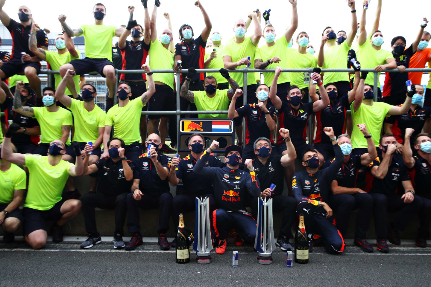 NORTHAMPTON, ENGLAND - AUGUST 09: Race winner Max Verstappen of Netherlands and Red Bull Racing celebrates with his team after the F1 70th Anniversary Grand Prix at Silverstone on August 09, 2020 in Northampton, England. (Photo by Mark Thompson/Getty Images)