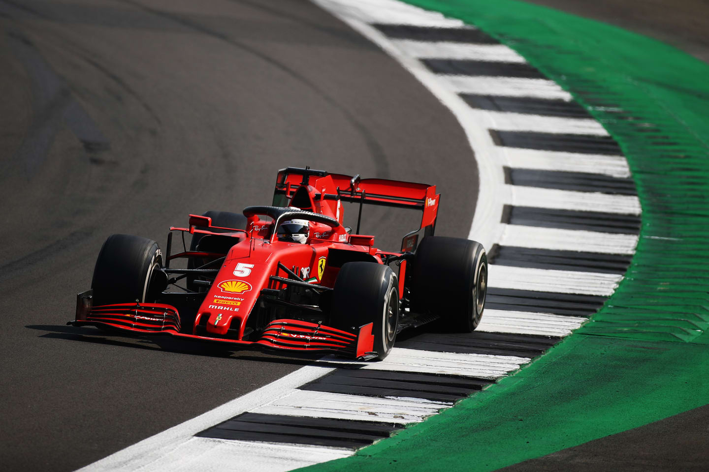 NORTHAMPTON, ENGLAND - AUGUST 09: Sebastian Vettel of Germany driving the (5) Scuderia Ferrari