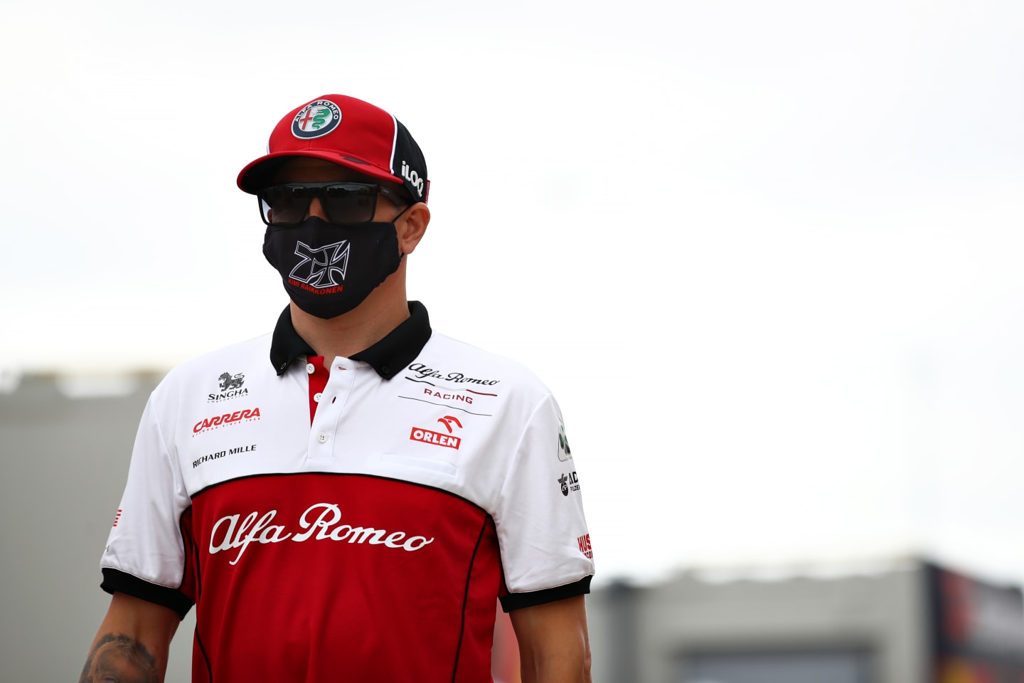 NORTHAMPTON, ENGLAND - AUGUST 06: Kimi Raikkonen of Finland and Alfa Romeo Racing walks in the