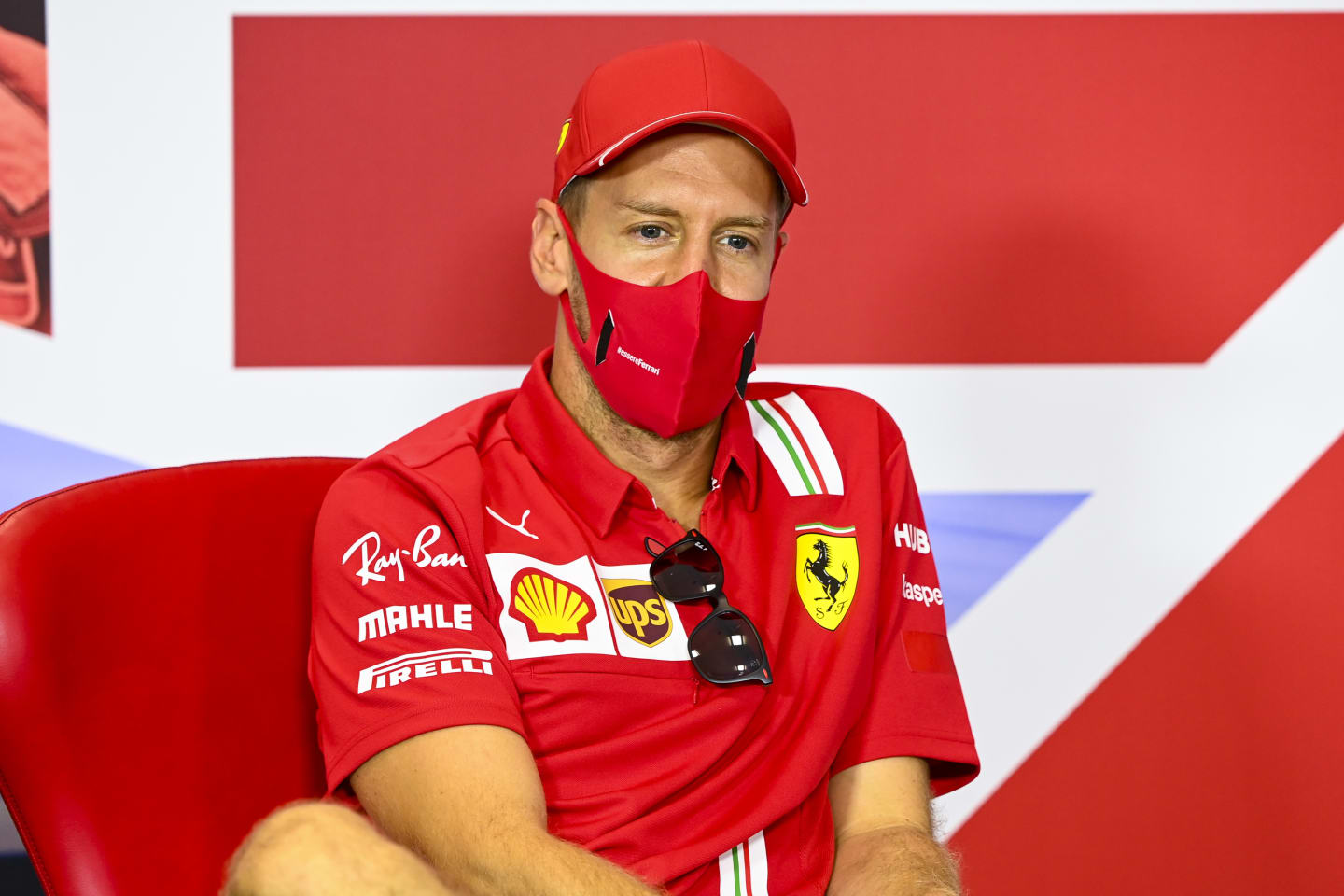 NORTHAMPTON, ENGLAND - AUGUST 06:  Sebastian Vettel of Germany and Ferrari talks in the drivers