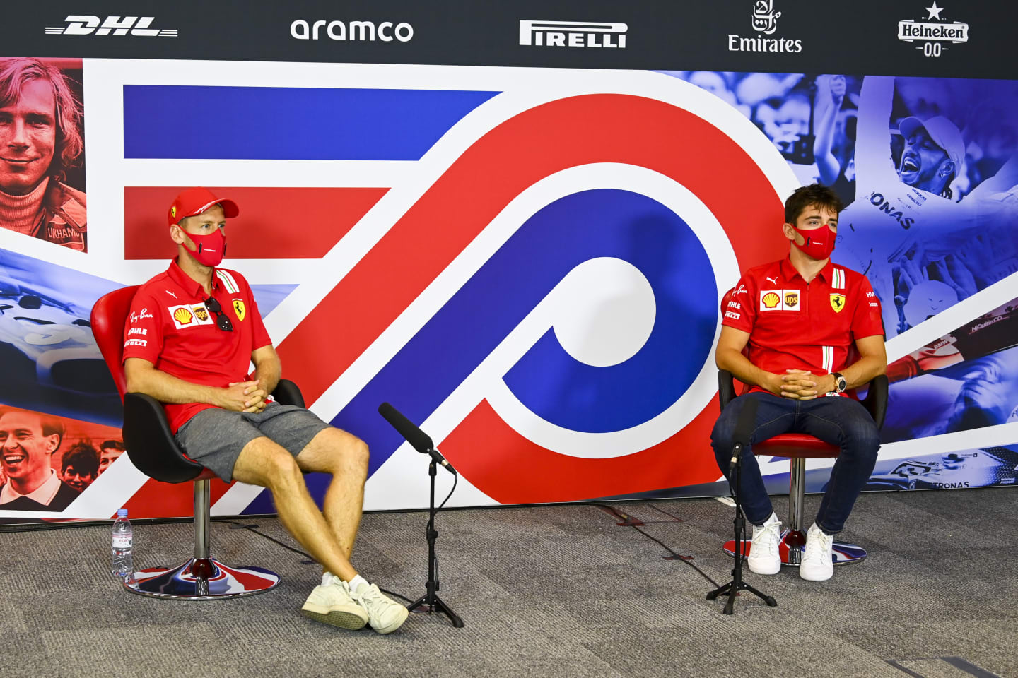 NORTHAMPTON, ENGLAND - AUGUST 06: Sebastian Vettel of Germany and Ferrari and Charles Leclerc of