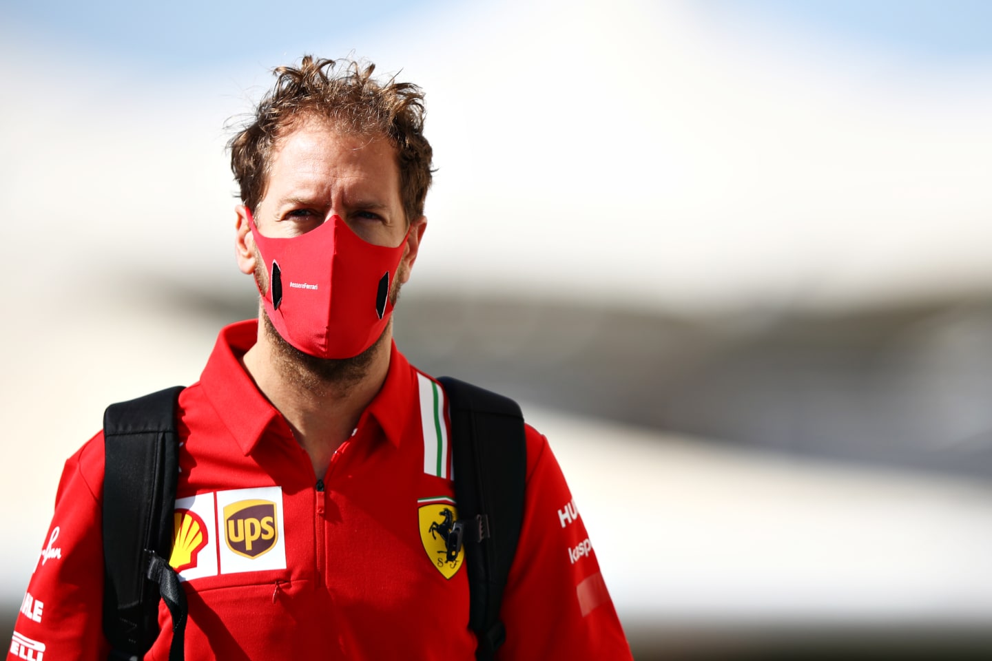 ABU DHABI, UNITED ARAB EMIRATES - DECEMBER 11: Sebastian Vettel of Germany and Ferrari walks in the