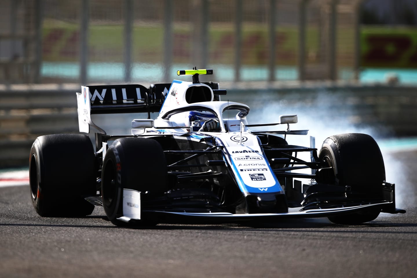 ABU DHABI, UNITED ARAB EMIRATES - DECEMBER 11: Nicholas Latifi of Canada driving the (6) Williams Racing FW43 Mercedes locks up during practice ahead of the F1 Grand Prix of Abu Dhabi at Yas Marina Circuit on December 11, 2020 in Abu Dhabi, United Arab Emirates. (Photo by Bryn Lennon/Getty Images)