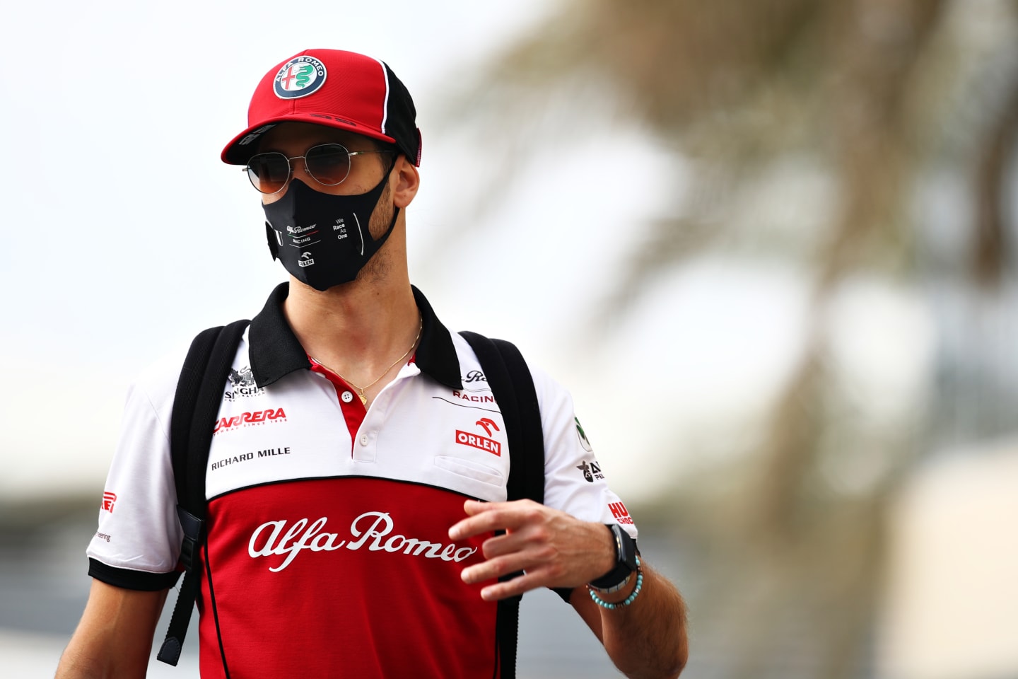 ABU DHABI, UNITED ARAB EMIRATES - DECEMBER 12: Antonio Giovinazzi of Italy and Alfa Romeo Racing walks in the Paddock before final practice ahead of the F1 Grand Prix of Abu Dhabi at Yas Marina Circuit on December 12, 2020 in Abu Dhabi, United Arab Emirates. (Photo by Mark Thompson/Getty Images)