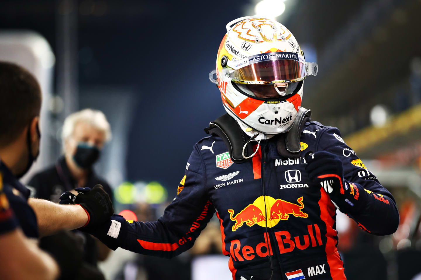 ABU DHABI, UNITED ARAB EMIRATES - DECEMBER 12: Pole position qualifier Max Verstappen of Netherlands and Red Bull Racing celebrates with his team in parc ferme during qualifying ahead of the F1 Grand Prix of Abu Dhabi at Yas Marina Circuit on December 12, 2020 in Abu Dhabi, United Arab Emirates. (Photo by Mark Thompson/Getty Images)